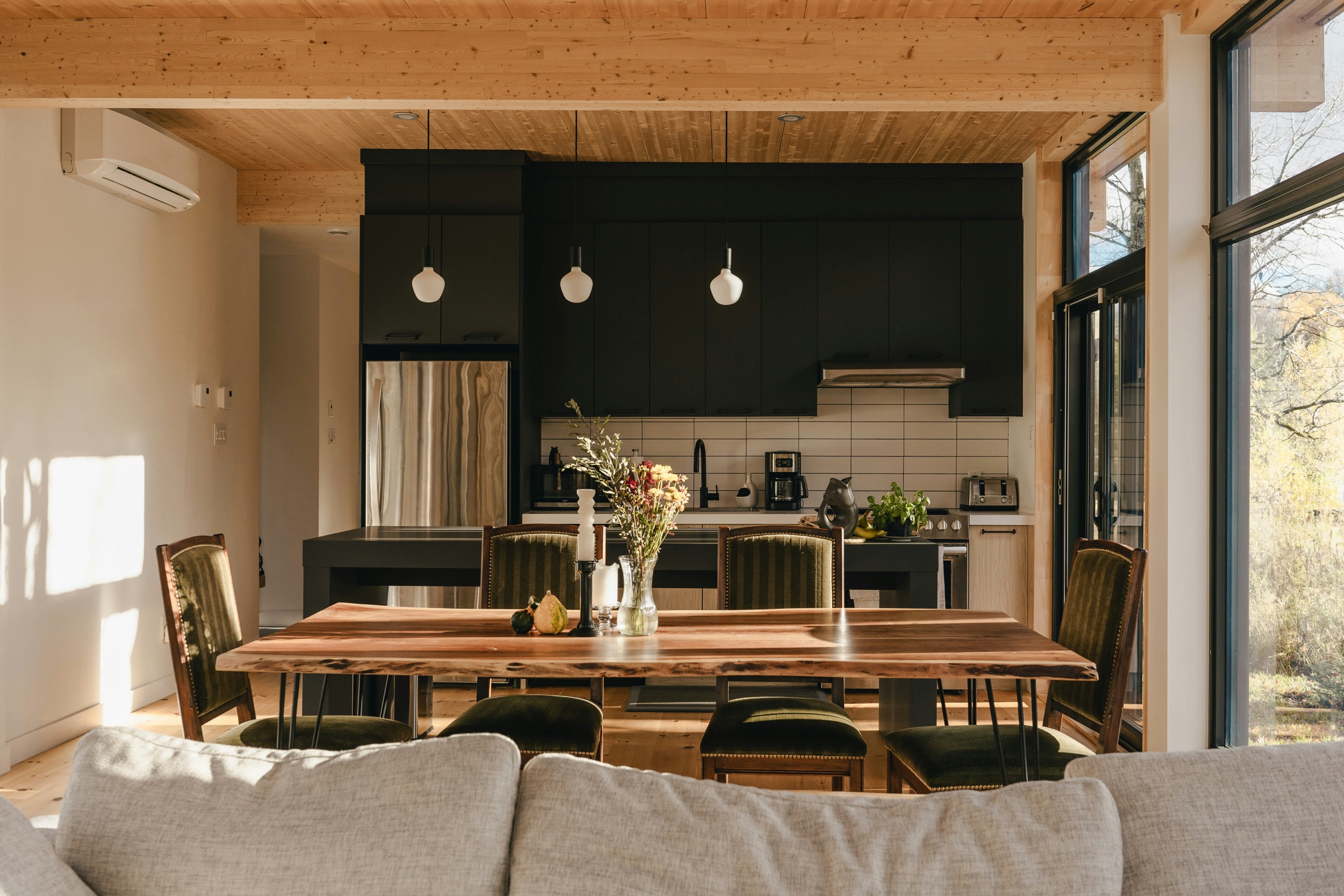 Architectural dining room and dark kitchen